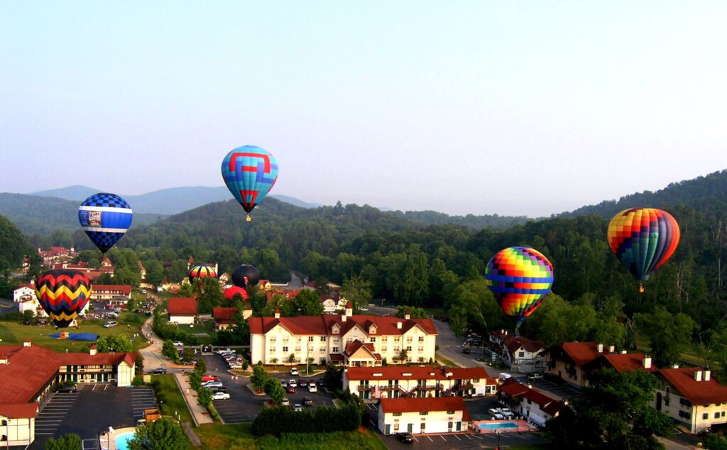 A group of balloons competing in the Helen to the Atlantic Race above Helen Georgia