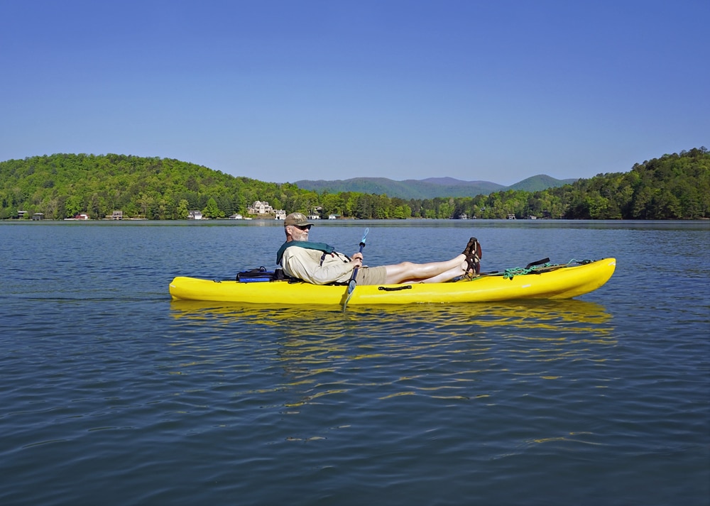 Man kayaking and enjoying all the things to do on Lake Rabun, one of the best lakes in Georgia