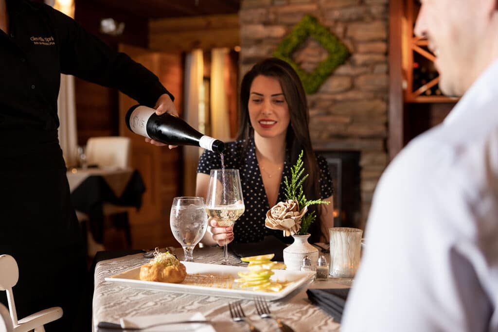 Couple enjoying dinner at Glen-Ella Springs during their romantic getaways in North Georgia