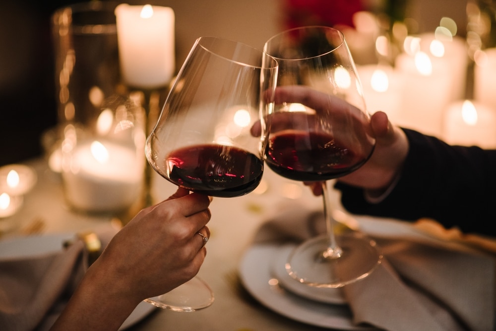 couple toasting with wine at one of the most romantic restaurants in Clarkesville, Georgia